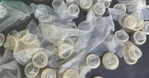 Who is mailing used condoms to Australian women?