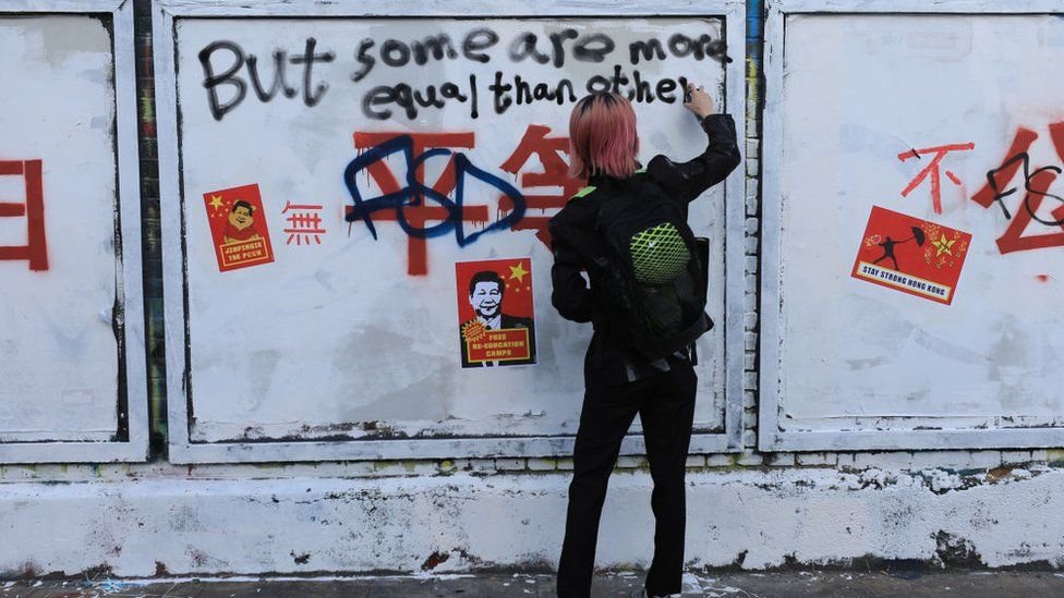 Chinese political slogans appear on London street art wall