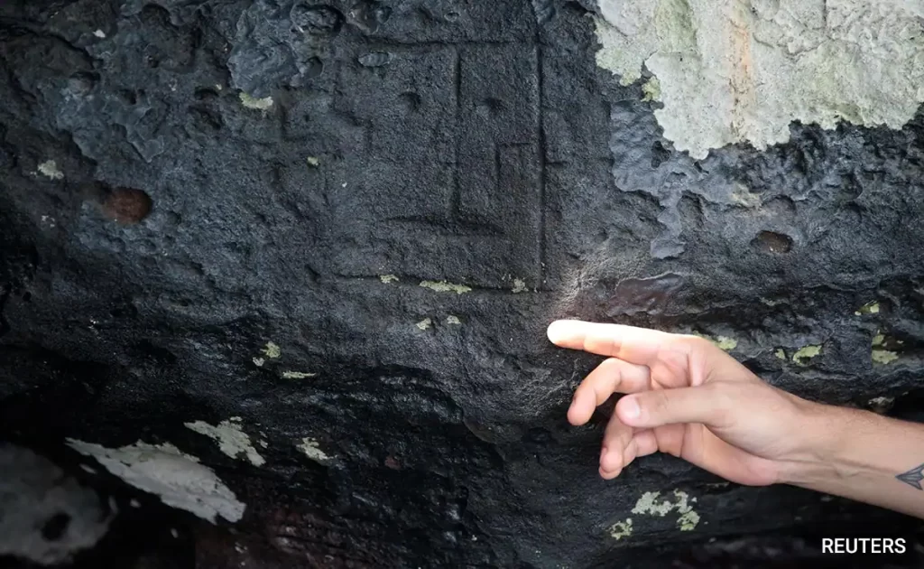Amazon river drought reveals 2,000-year-old human faces sculpted in stone