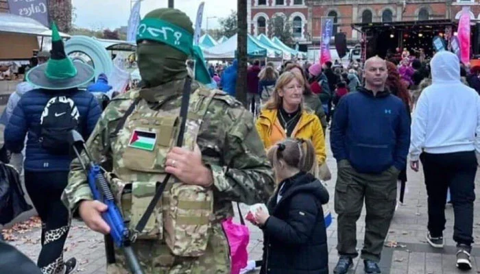 'Hamas' Halloween costume sparks controversy in Northern Ireland. Northern Irish authorities are investigating a puzzling incident involving an image circulated on social media portraying an individual dressed as a Hamas militant at a Halloween festival in Londonderry.