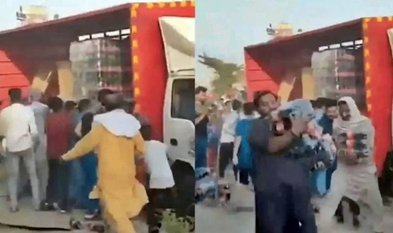 Video: Truck transporting soft drinks looted in Faisalabad after crash